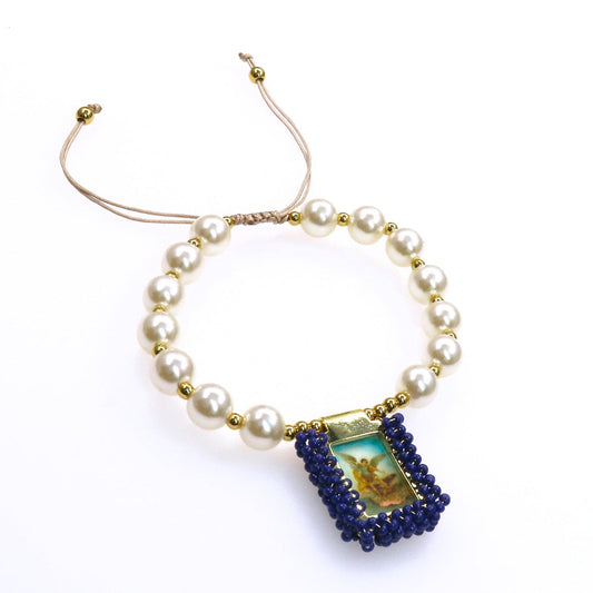Adjustable pearl escapulario bracelet with blue beaded religious pendant and gold accents