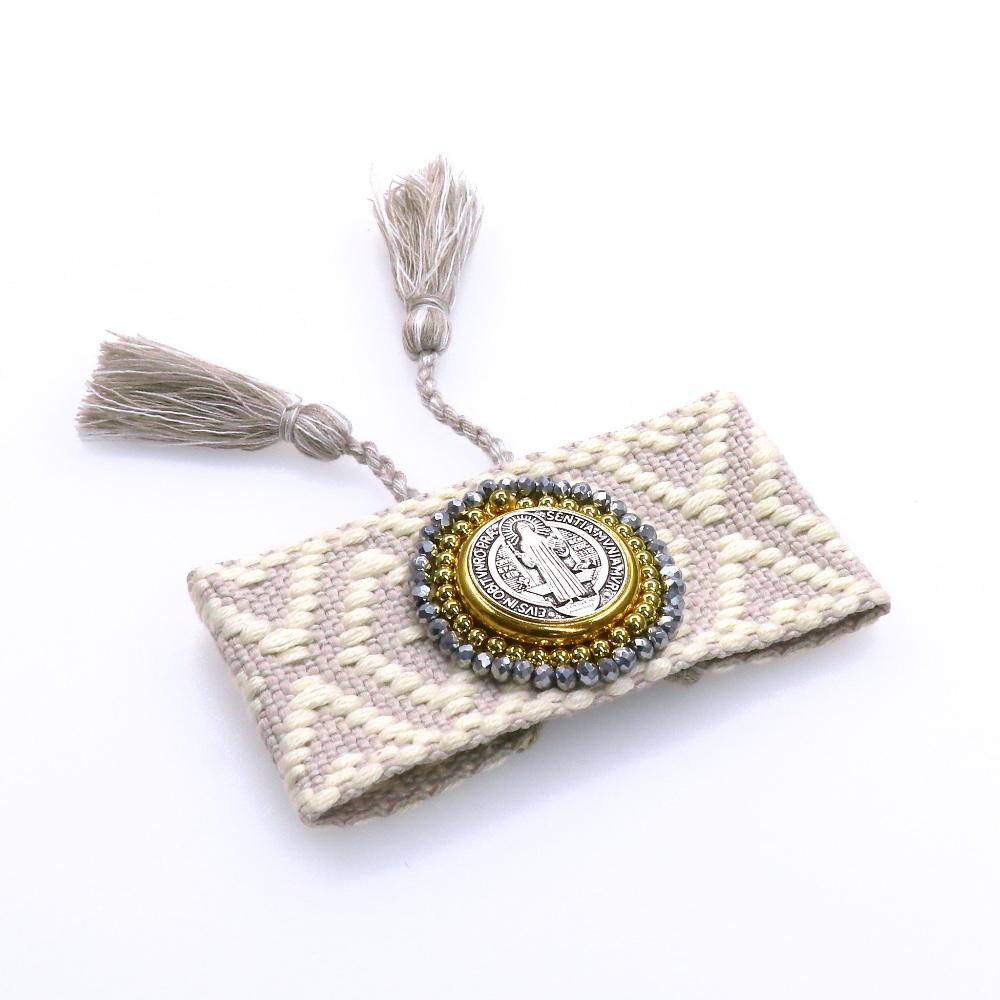 Handmade San Benito fabric bracelet with iconic medallion and decorative tassels