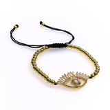 SHINE EVIL EYE slider bracelet with baguette crystal evil eye charm and black adjustable cord