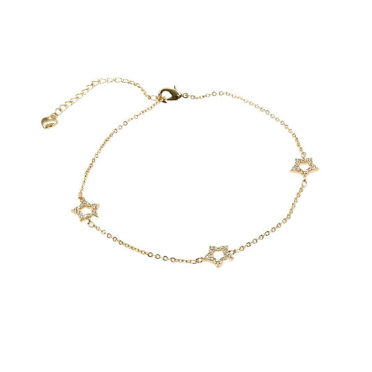 Delicate gold star anklet bracelet with three small star charms and adjustable chain clasp
