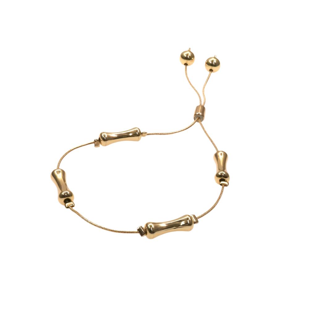 Gold bone slider bracelet with adjustable cord and unique bone-shaped design