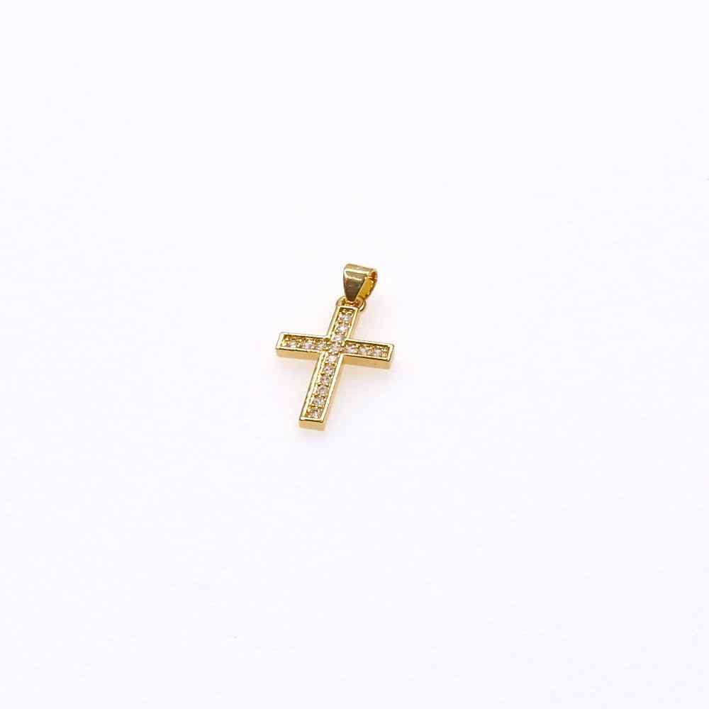 Mini pave cross charm pendant with intricate detailing and gold finish