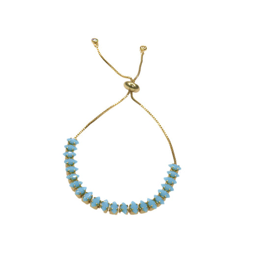 Gold slider bracelet with blue zirconia stones and adjustable chain clasp