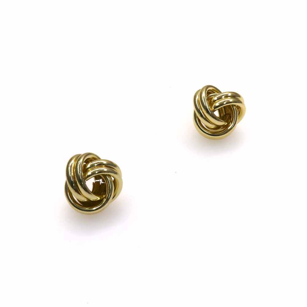 Gold knot stud earrings with elegant, timeless design on white background