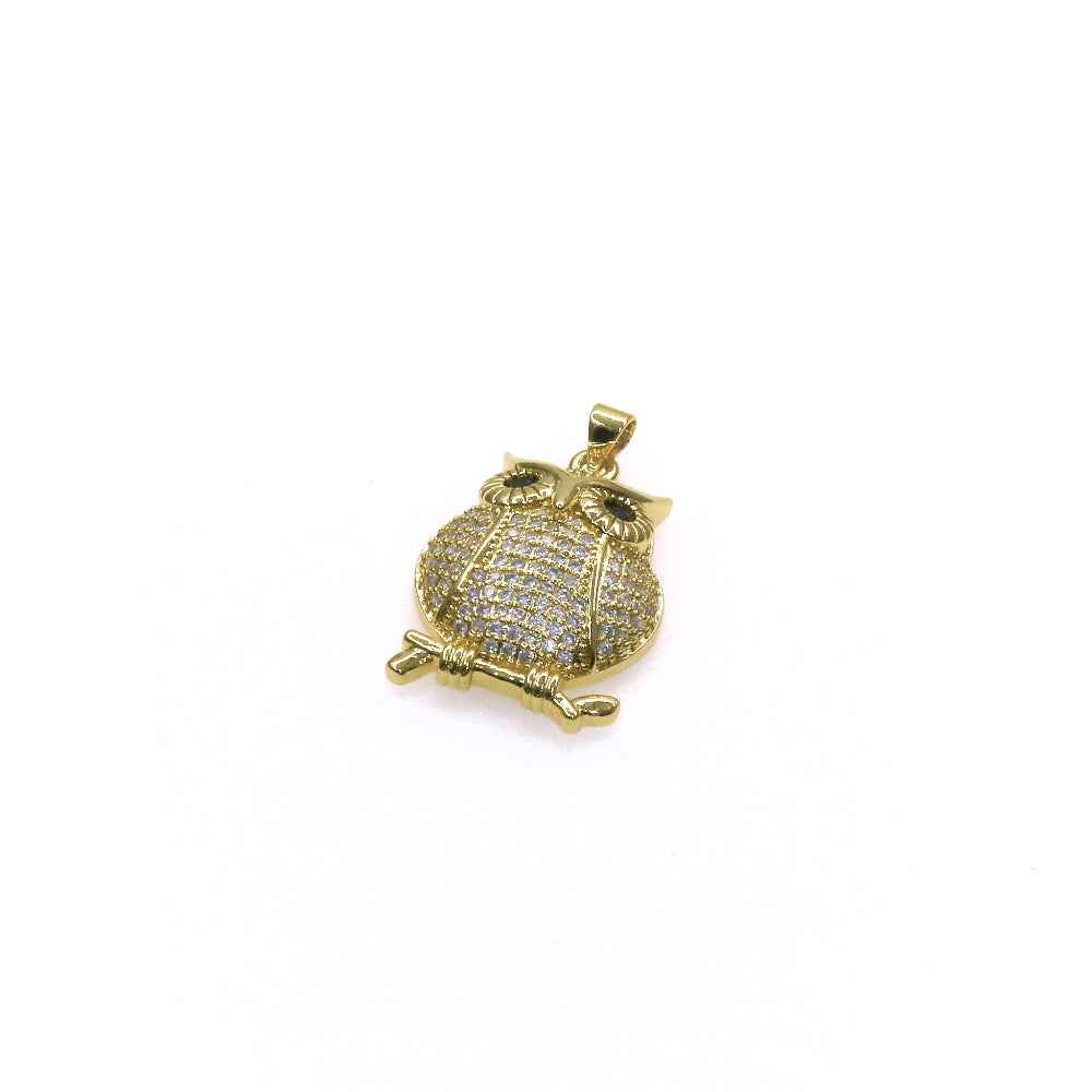 Gold owl charm pendant with pave stones and intricate design