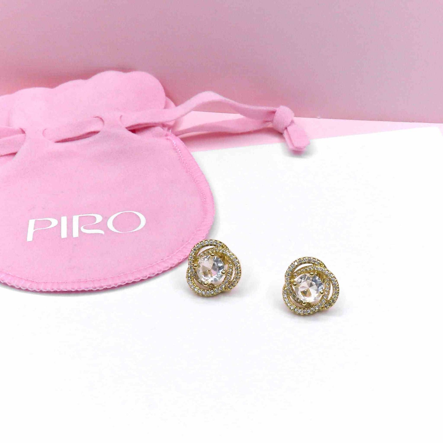 SHINE KNOT SUTD earrings with pink drawstring pouch