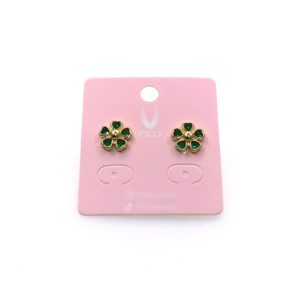 Small flower stud earrings with green petals and gold edges on a pink display card