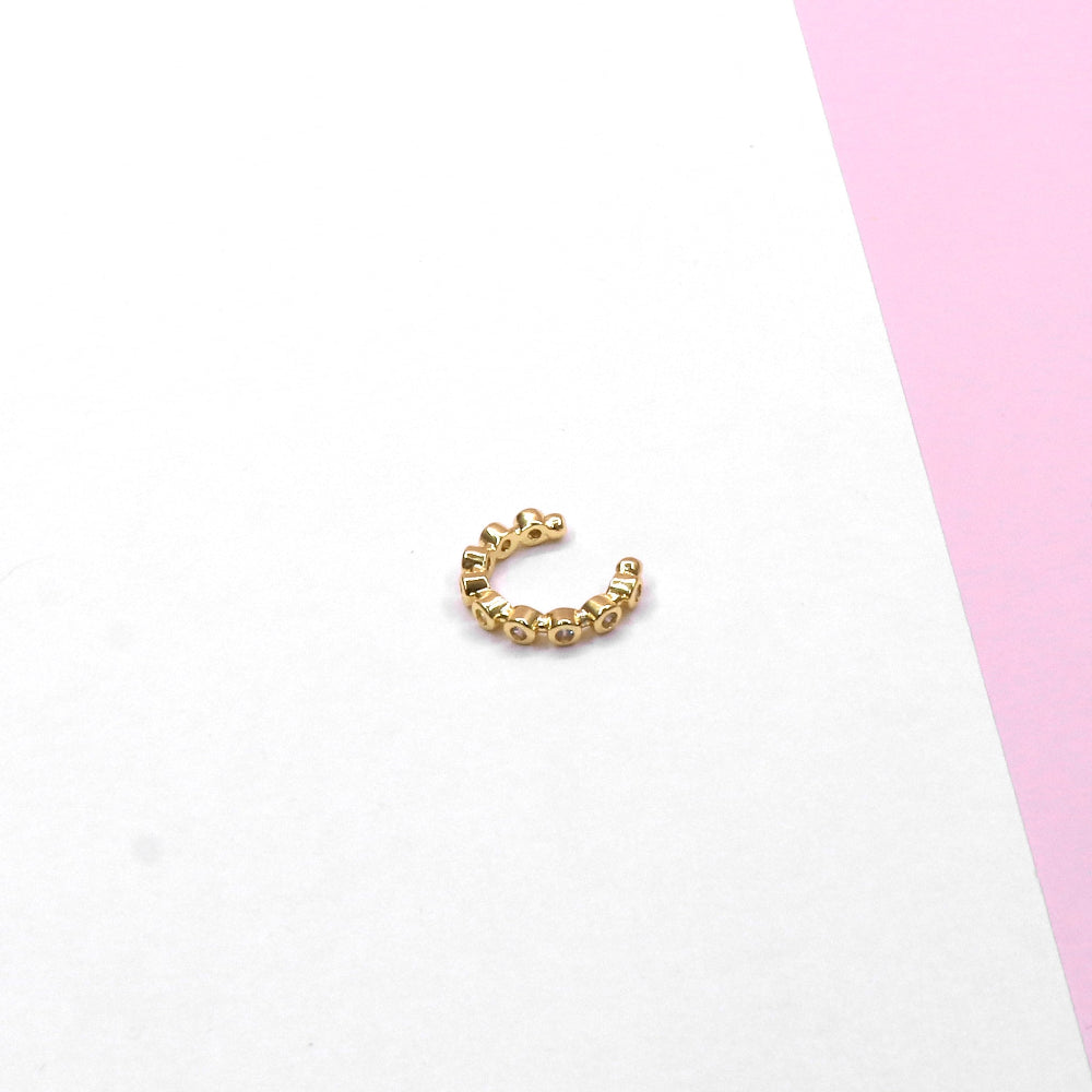 MINI ZIRCONIA CUFF in gold-tone with small rounded beads design on white and pink background