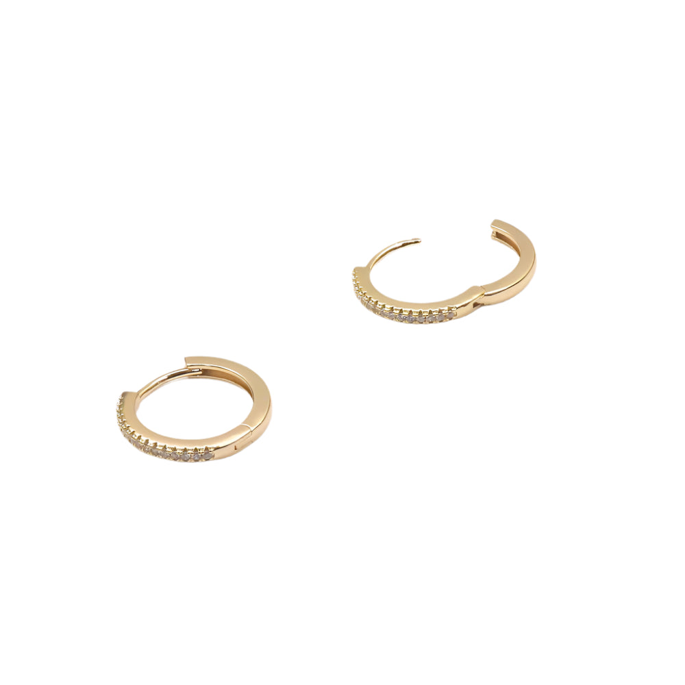 Gold-filled SKINY HUGGIE earrings with small sparkling stones, elegant and durable design.