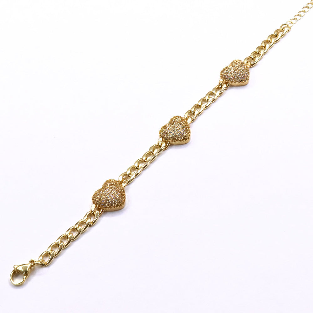 Gold-filled Cuban link chain bracelet with three sparkling heart charms