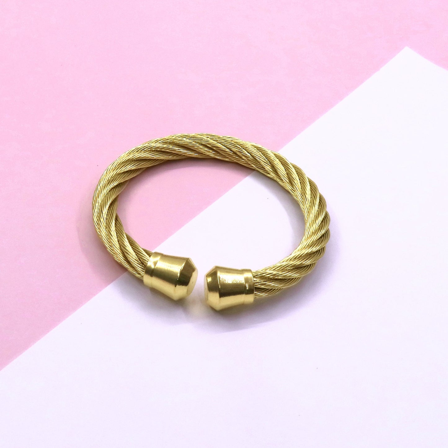 CHUNKY CABLE GLD stainless steel bracelet on pink and white background