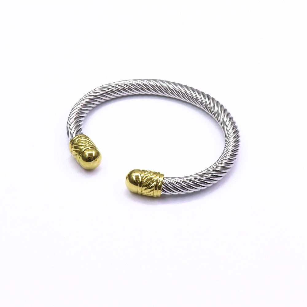 Stainless steel chunky cable bracelet with gold-tone end caps on white background