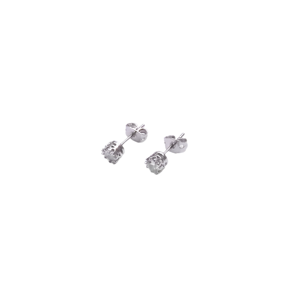 Pair of silver stud earrings on a white background