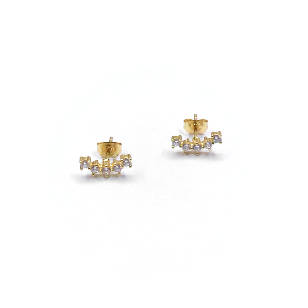 Gold earrings with small diamonds on a white background