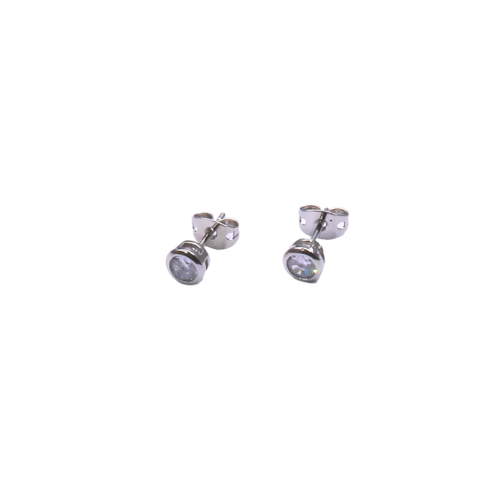 Pair of silver stud earrings on a white background