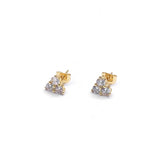 Gold and silver stud earrings on a white background