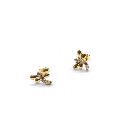 Pair of gold bow-shaped earrings on a white background