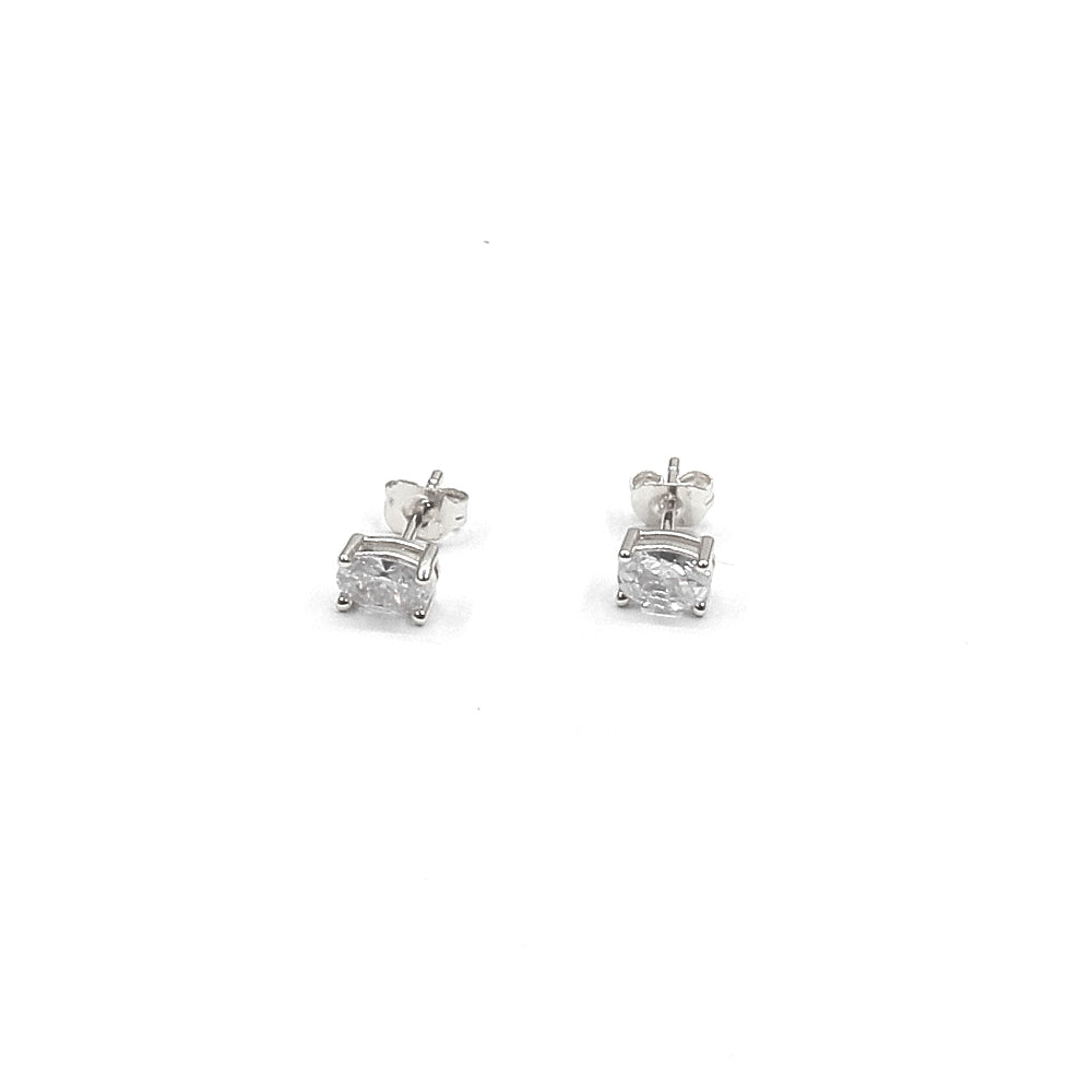 Pair of diamond stud earrings on a white background