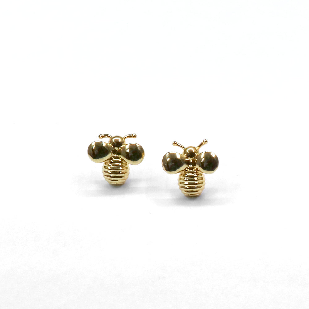 Gold bee-shaped earrings on a white background