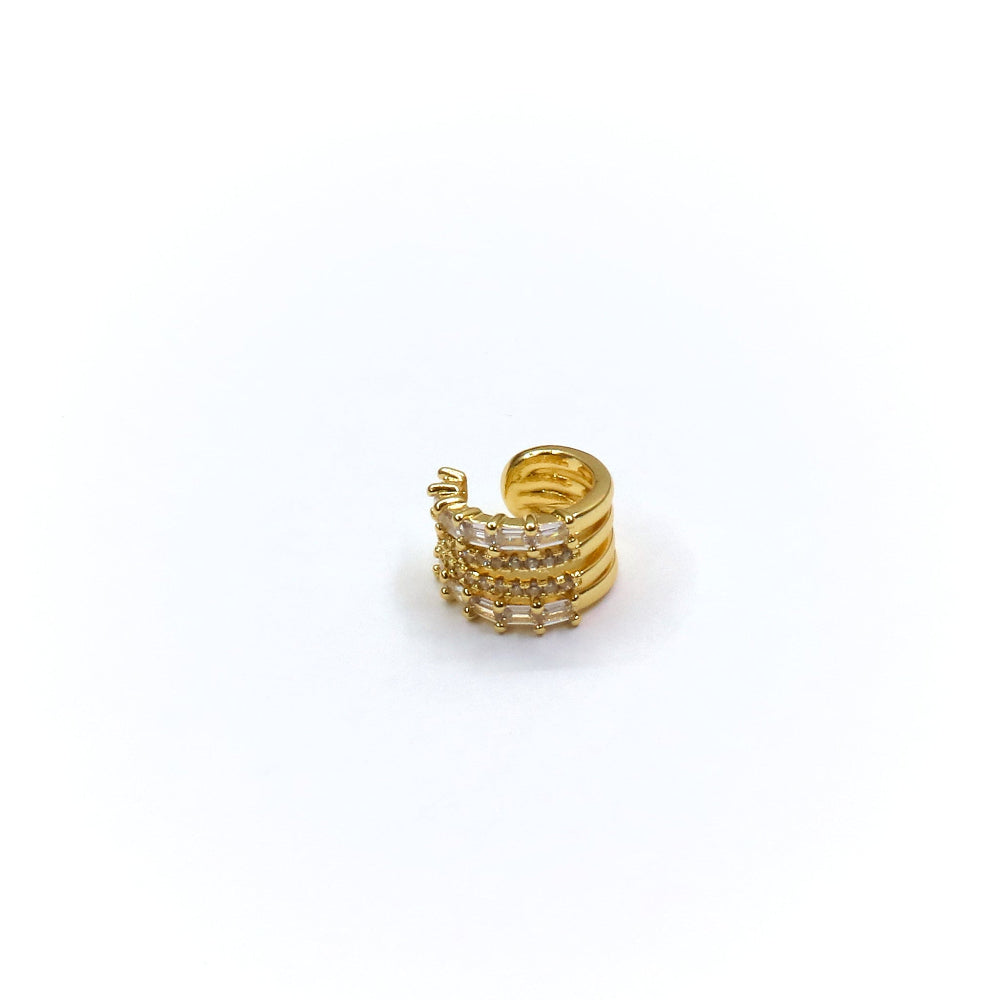Gold ring with multiple bands on a white background