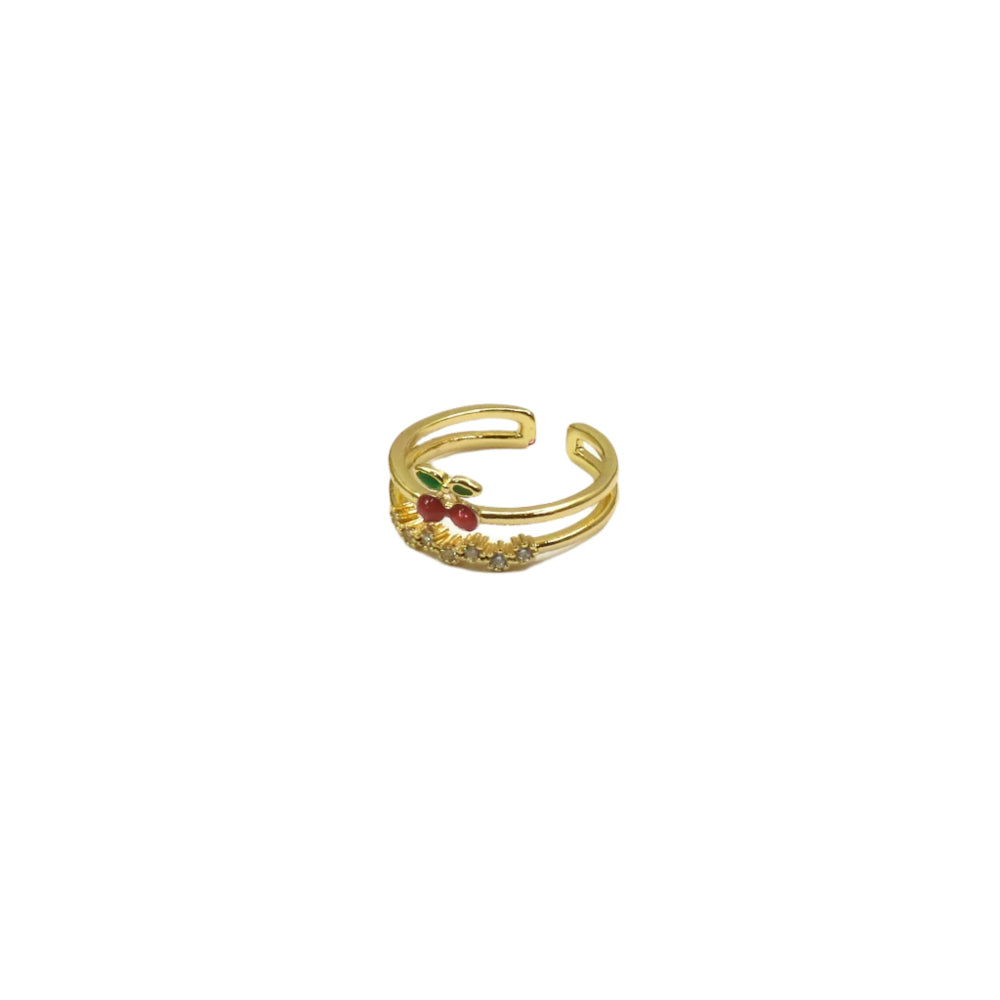 Gold ring with red stones on a white background