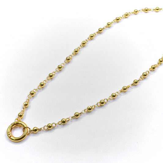 Gold necklace with a clasp on a white background