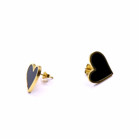 Heart-shaped earrings with black hearts and gold metal on a white background