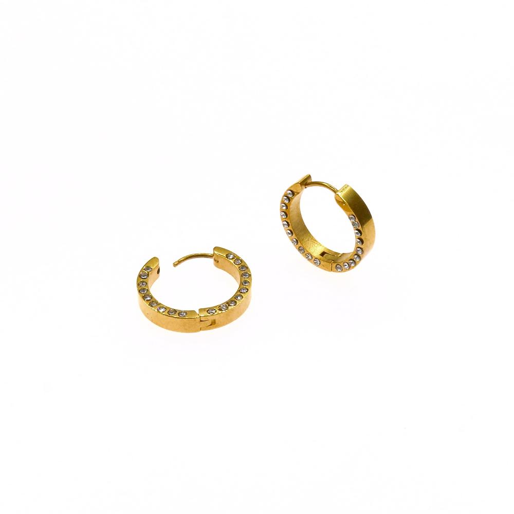Golden huggie hoop earrings with sparkling crystals on a white background