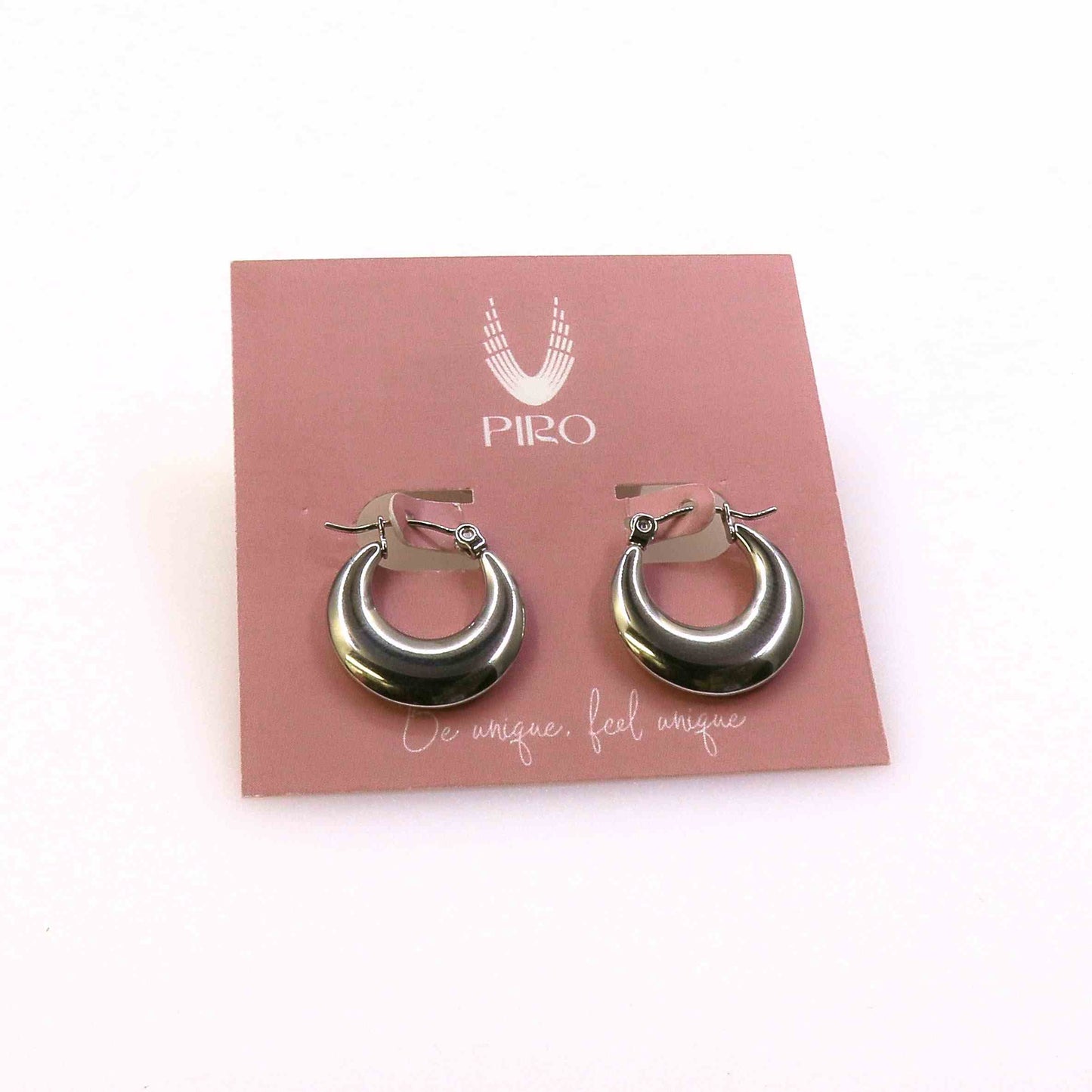 Modern flat earrings made from premium stainless steel on a display card, showcasing a sleek, contemporary design.