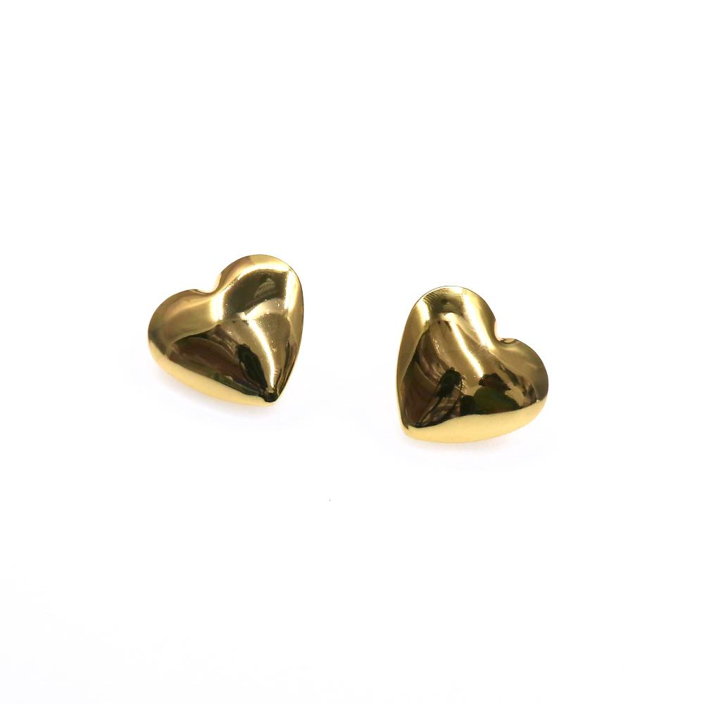 Pair of shiny gold chunky heart-shaped earrings on white background