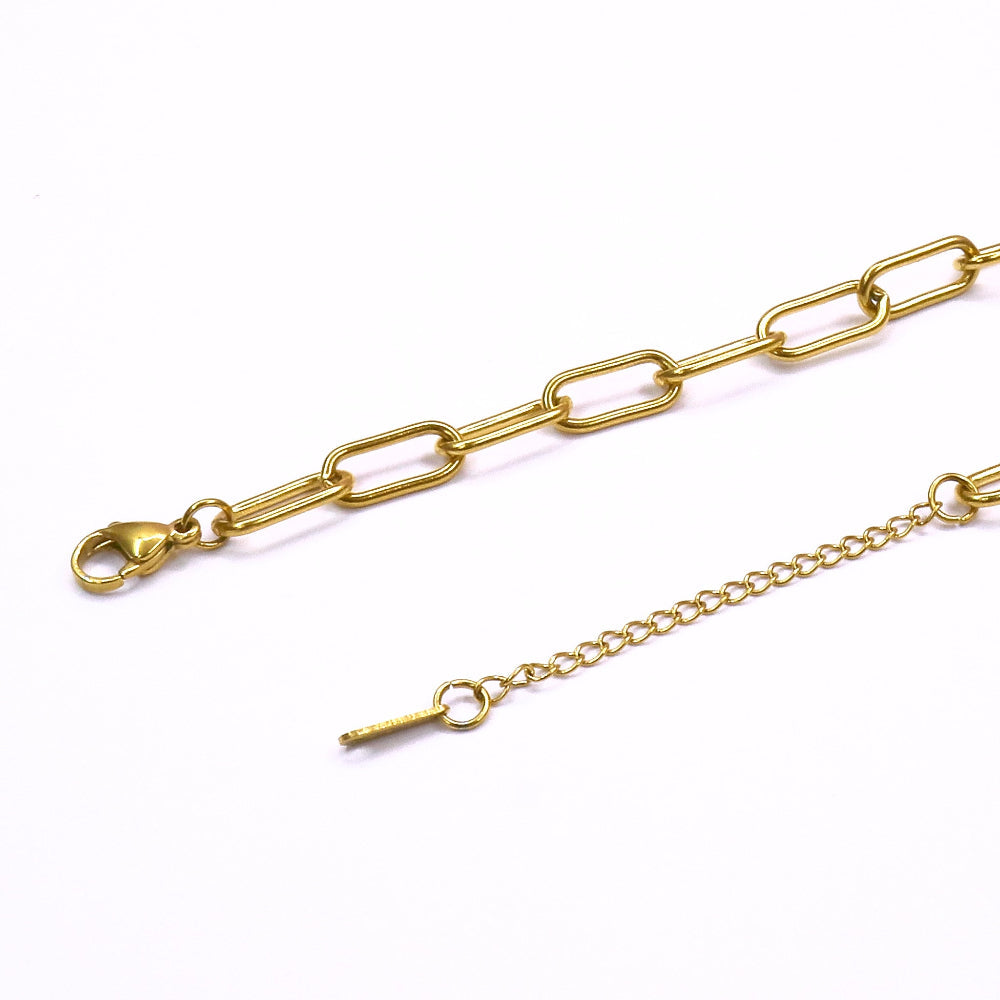 gold chain bracelet with lobster clasp on white background