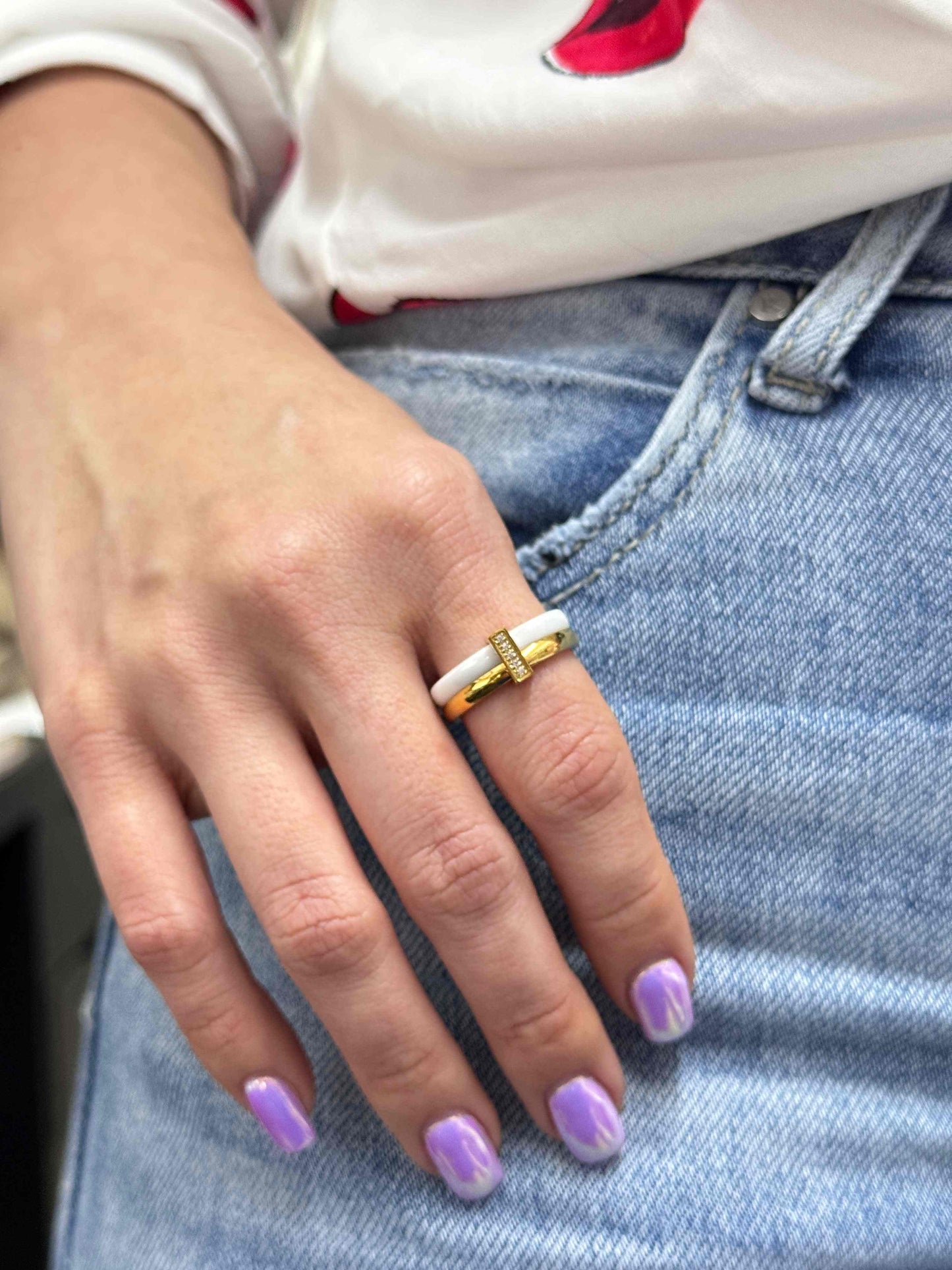 CERAMIC WHITE RING with pave crystal link worn on hand with purple nail polish