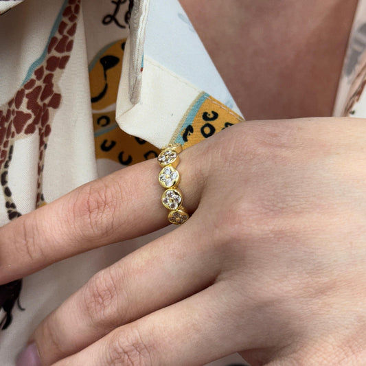 Gold-filled adjustable ring with CLEAR PAVE CLOVER stones in a clover design on finger