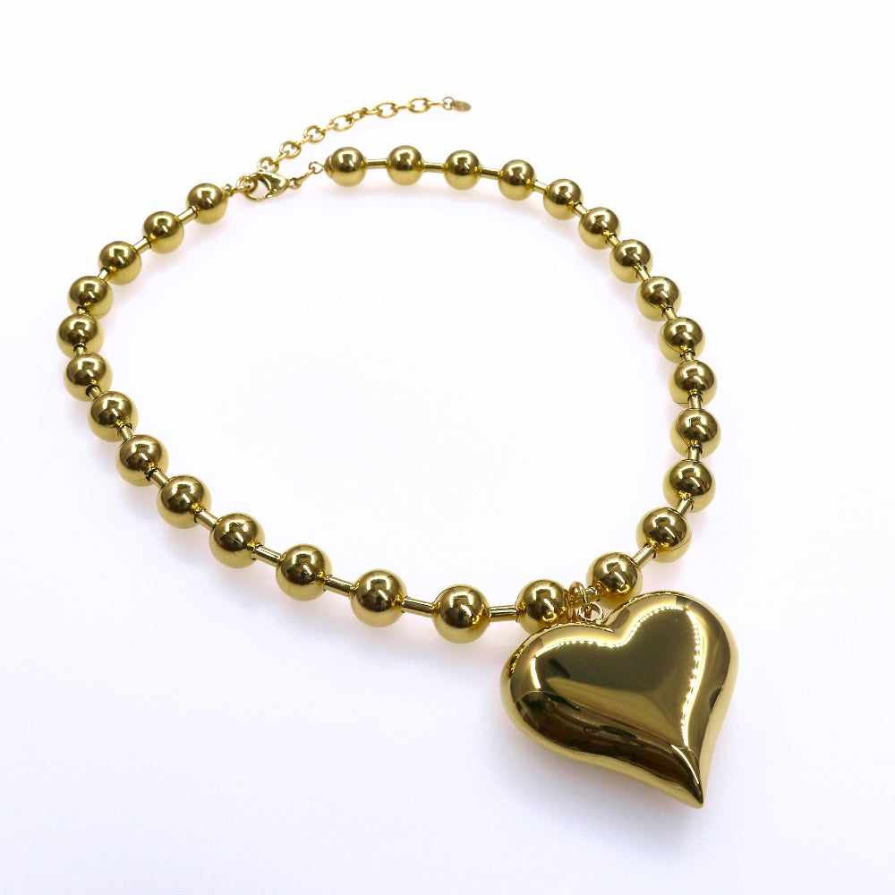 Chunky beads chain with heart and big ball design in gold.