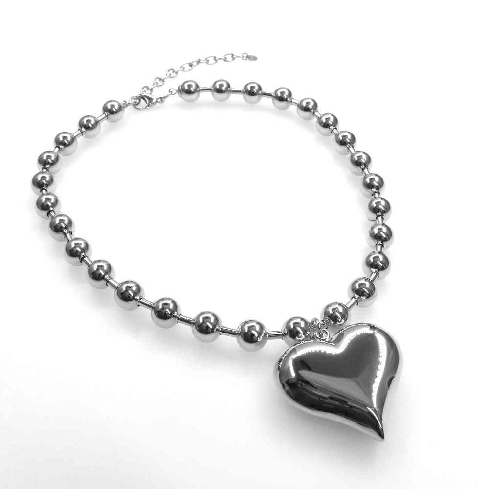 Chunky beads chain with heart design in silver and gold tones.