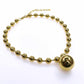Chunky gold beads chain with heart, star, and big ball designs.