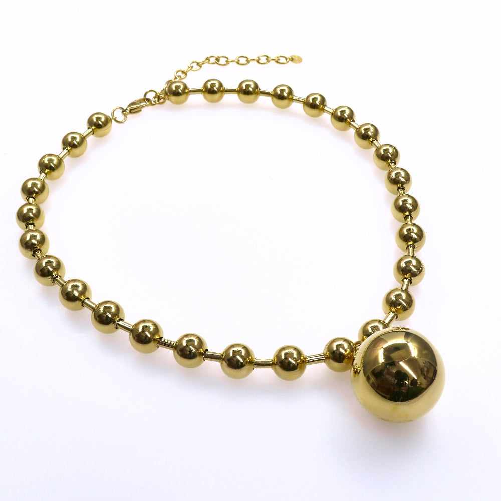 Chunky gold beads chain with heart, star, and big ball designs.