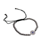 Small evil eye bracelet with silver beads and adjustable black slider cord featuring a silver circle eye charm