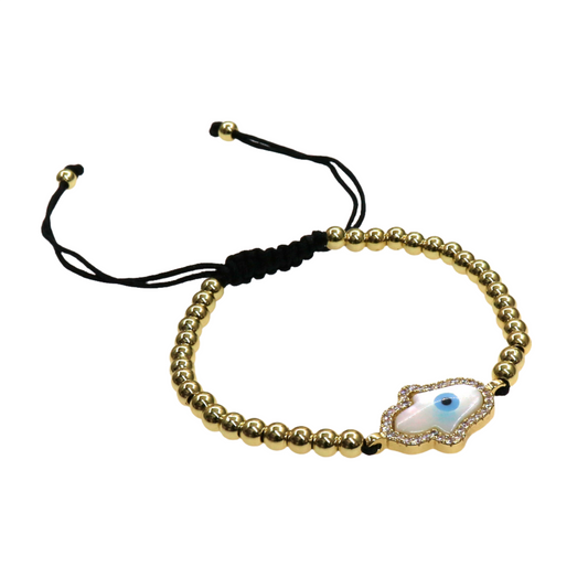 Elegant HAMSA bracelet with gold slider beads and a silver charm featuring an eye design on adjustable black cord
