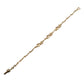 Gold bracelet on a light purple background