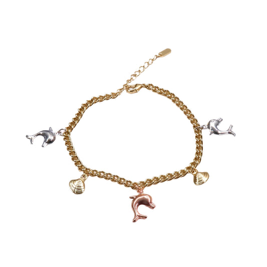 Gold bracelet with various charms on a white background