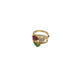 Gold ring with gemstones on a white background