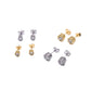 Set of gold and silver earrings on a white background