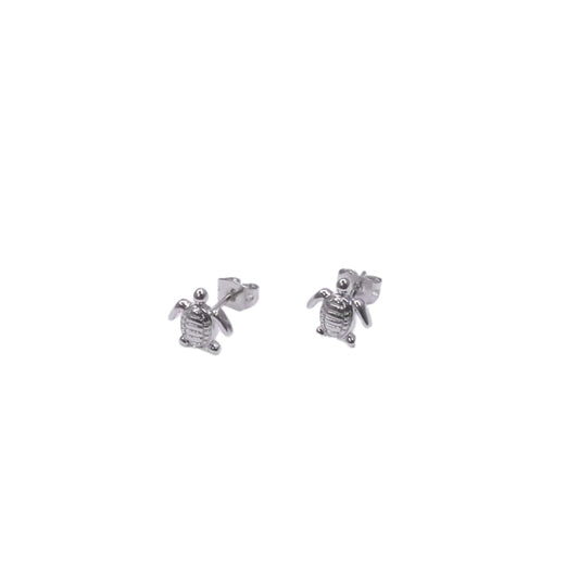 Silver turtle earrings on a white background