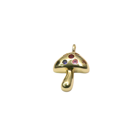 Gold mushroom pendant with embedded stones on a light purple background