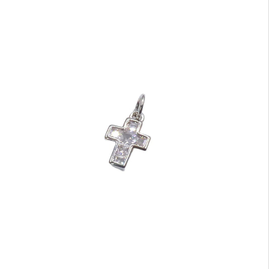 Silver cross pendant with clear stones on a white background
