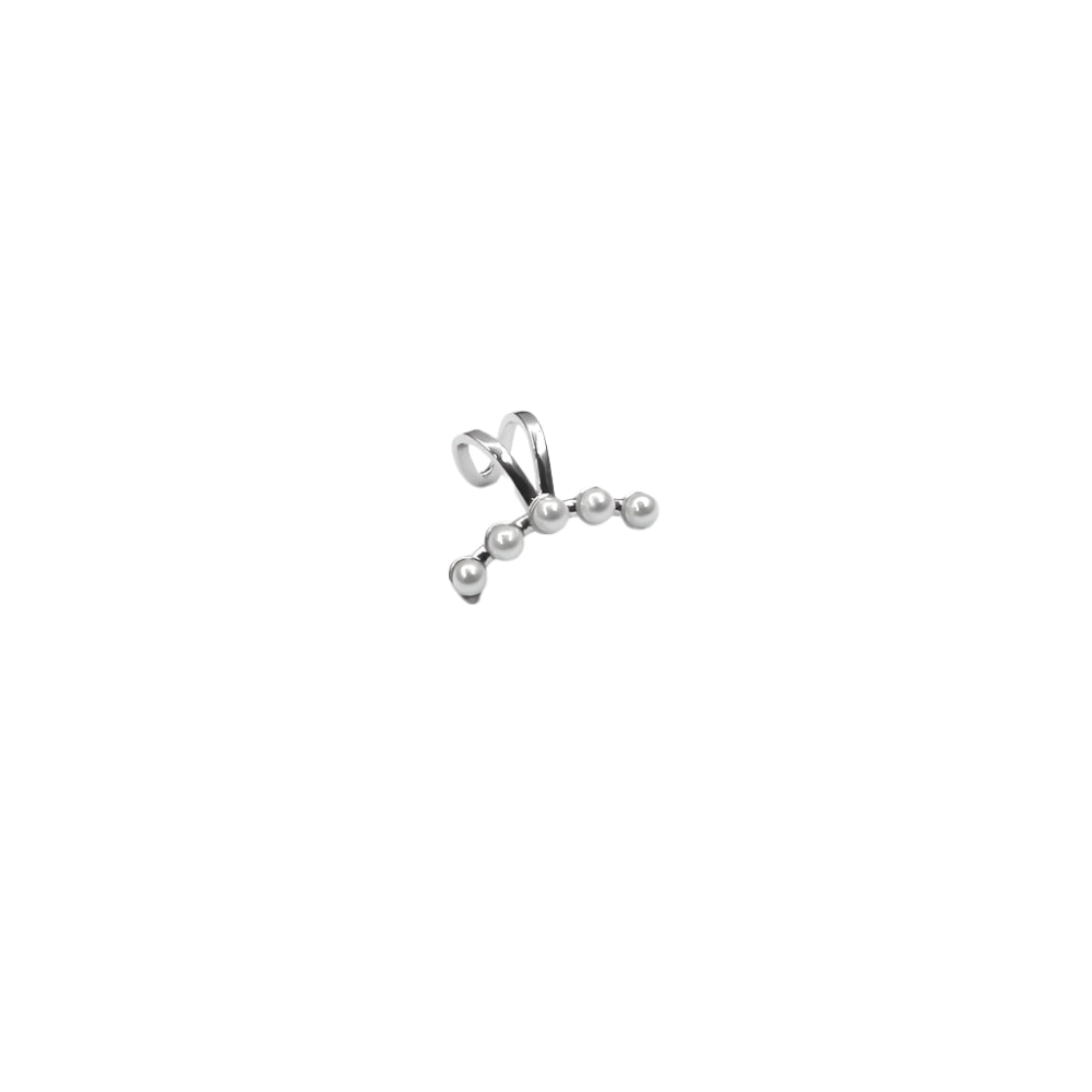 Silver ring with three pearls on a white background