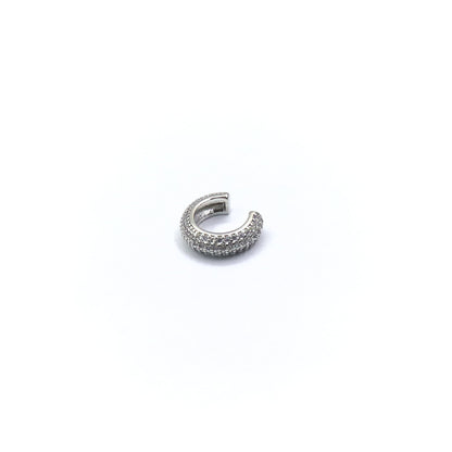 Silver earring with small stones on a white background