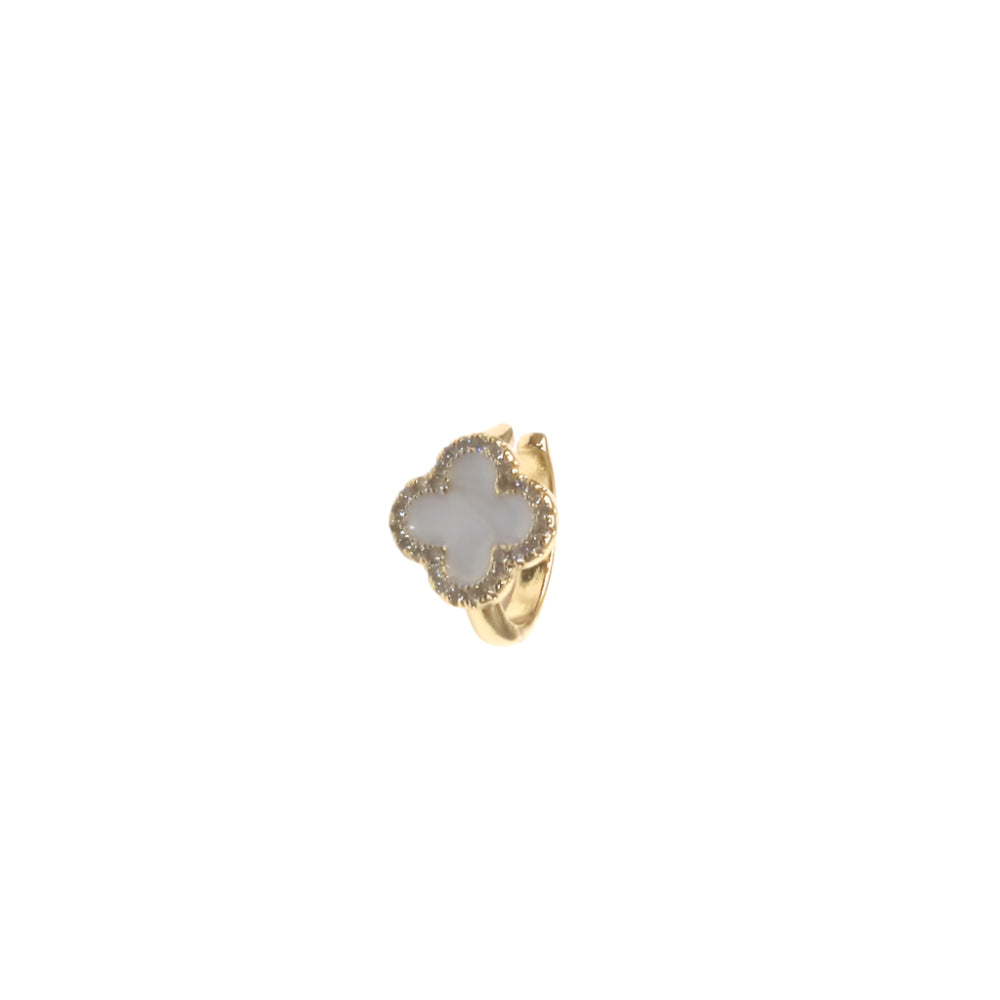 Gold ring with a white stone on a white background
