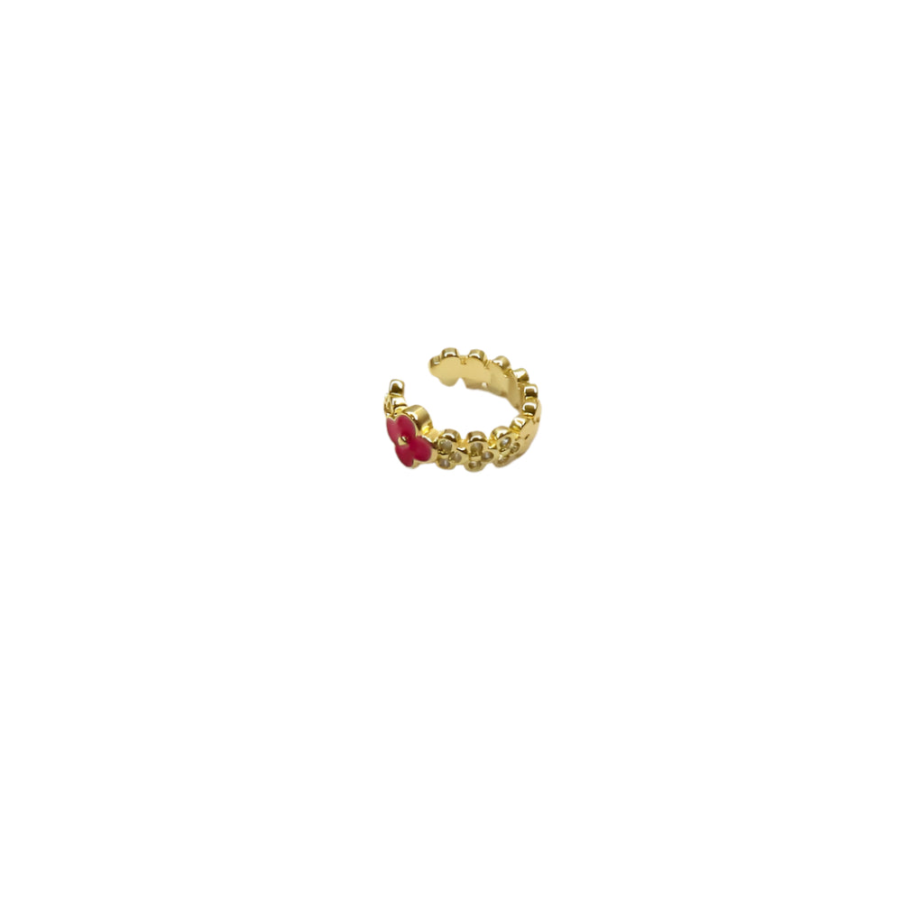 Gold ring with a red gemstone on a white background